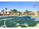 Neighborhood full basketball court and playground, fenced in for safe recreation at 5456 Raccoon Valley Ln, Las Vegas, NV 89122