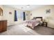 Bedroom features a bed with wood frame, carpeted floors, and natural light at 5456 Raccoon Valley Ln, Las Vegas, NV 89122