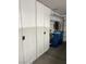 Garage features built in storage and shelving, with plenty of space for vehicles and storage at 5456 Raccoon Valley Ln, Las Vegas, NV 89122