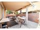 Covered patio provides an outdoor dining area with a BBQ for entertaining at 5456 Raccoon Valley Ln, Las Vegas, NV 89122