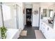 Bright bathroom features a separate shower, soaking tub, double vanity, and a spacious walk-in closet at 5733 Coral Sun St, North Las Vegas, NV 89031