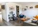 Inviting living room with stylish decor, wood-look flooring, comfortable seating, and an open doorway at 5733 Coral Sun St, North Las Vegas, NV 89031