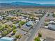 Single Gathering house has desert landscaping with a spacious front yard and mountain views at 6490 Wagon Wheel Ct, Pahrump, NV 89061