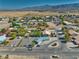 Single Gathering house has desert landscaping with a spacious front yard and mountain views at 6490 Wagon Wheel Ct, Pahrump, NV 89061