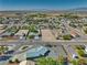 Single Gathering house has desert landscaping with a spacious front yard and mountain views at 6490 Wagon Wheel Ct, Pahrump, NV 89061