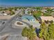 Bright single-story home boasts desert landscaping, circular driveway, and mountain views in a suburban neighborhood at 6490 Wagon Wheel Ct, Pahrump, NV 89061