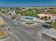 Aerial shot of a well-kept community featuring mature landscaping, houses with large lots, and paved streets at 6490 Wagon Wheel Ct, Pahrump, NV 89061