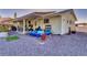 Large backyard featuring a covered patio area with string lights and a small above ground pool with flowering plants at 6490 Wagon Wheel Ct, Pahrump, NV 89061