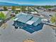 Aerial view of backyard with covered patio, gravel landscaping, and a small pool at 6490 Wagon Wheel Ct, Pahrump, NV 89061