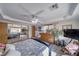 Bedroom features wood-style floors, large mirror closet, and comfortable bedding at 6490 Wagon Wheel Ct, Pahrump, NV 89061