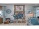 Living room's stone fireplace is decorated with candles and flowers at 6490 Wagon Wheel Ct, Pahrump, NV 89061