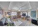 Cozy living room with large windows, a comfortable sofa, and hardwood floors at 6490 Wagon Wheel Ct, Pahrump, NV 89061