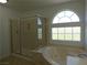 Bright bathroom featuring a glass enclosed shower and soaking tub at 6604 Octave Ave, Las Vegas, NV 89139