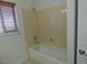This bathroom has a shower and window with blinds at 6604 Octave Ave, Las Vegas, NV 89139