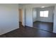 Bedroom features dark wood floors and mirrored closet doors at 6604 Octave Ave, Las Vegas, NV 89139
