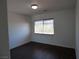 Bedroom featuring wood-look flooring and a bright window at 6604 Octave Ave, Las Vegas, NV 89139