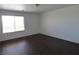 Bedroom featuring wood-look flooring and a bright window at 6604 Octave Ave, Las Vegas, NV 89139