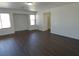 Spacious bonus room with wood floors, natural light, and ample space for relaxing and entertaining at 6604 Octave Ave, Las Vegas, NV 89139