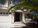 Front entrance with a two-car garage and landscaped front yard at 6604 Octave Ave, Las Vegas, NV 89139