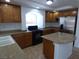 Spacious kitchen with granite countertops, stainless appliances, and a large island at 6604 Octave Ave, Las Vegas, NV 89139