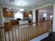 Well-equipped kitchen with island, wood cabinets, and open floor plan to the living room at 6604 Octave Ave, Las Vegas, NV 89139