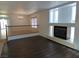Cozy living room with fireplace and abundant natural light for a welcoming atmosphere at 6604 Octave Ave, Las Vegas, NV 89139