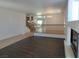 Living room featuring hardwood floors, staircase, and fireplace at 6604 Octave Ave, Las Vegas, NV 89139