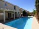 Large backyard pool with covered patio, perfect for entertaining and enjoying the outdoors at 6604 Octave Ave, Las Vegas, NV 89139