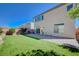 Spacious backyard featuring artificial turf, brick-paved patio, and privacy wall perfect for outdoor entertaining at 6790 Tangled Vines Ave, Las Vegas, NV 89139