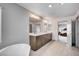 Bright bathroom features double sinks and granite countertops at 6790 Tangled Vines Ave, Las Vegas, NV 89139