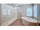 Beautiful bathroom featuring a soaking tub, a large glass shower, and modern fixtures at 6790 Tangled Vines Ave, Las Vegas, NV 89139