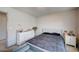 Cozy bedroom with white dresser and grey patterned bedding at 6790 Tangled Vines Ave, Las Vegas, NV 89139