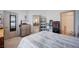 Bright bedroom with a large bed, neutral tones, and convenient storage solutions at 6790 Tangled Vines Ave, Las Vegas, NV 89139