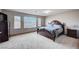 Bedroom features neutral tones, a comfortable bed, and lots of natural light at 6790 Tangled Vines Ave, Las Vegas, NV 89139