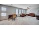 Spacious bonus room with comfortable leather seating, a desk, and lots of natural light at 6790 Tangled Vines Ave, Las Vegas, NV 89139