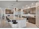 A modern kitchen featuring a large island, stainless steel appliances, and contemporary cabinetry at 6790 Tangled Vines Ave, Las Vegas, NV 89139