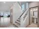 Carpeted staircase leads to a bright upstairs with access to a well-lit powder room at 6790 Tangled Vines Ave, Las Vegas, NV 89139