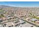 Wide aerial perspective of a sprawling neighborhood featuring many homes and community landscaping at 716 Cadence View Way, Henderson, NV 89011