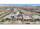 An aerial of a well-maintained community showcasing lush landscaping, solar panels, and convenient street access at 716 Cadence View Way, Henderson, NV 89011
