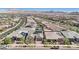 An aerial of a well-maintained community showcasing lush landscaping, solar panels, and convenient street access at 716 Cadence View Way, Henderson, NV 89011
