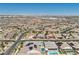 Stunning aerial shot showcasing a large residential area with solar panels, pools, and neatly arranged homes at 716 Cadence View Way, Henderson, NV 89011