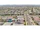 Extensive aerial panorama of a community with diverse homes, streets, pools, and green landscaping at 716 Cadence View Way, Henderson, NV 89011