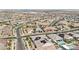Expansive aerial view of a vibrant community with a mix of single-Gathering homes, pools, and well-maintained streets at 716 Cadence View Way, Henderson, NV 89011