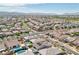 High-altitude aerial view of a vast residential area featuring houses, landscaping, and street layout at 716 Cadence View Way, Henderson, NV 89011