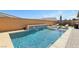 Secluded backyard with a private pool, waterfall feature, and ample space for relaxation and recreation at 716 Cadence View Way, Henderson, NV 89011