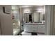 Lovely bathroom featuring modern fixtures, double vanity, and glass-enclosed shower at 716 Cadence View Way, Henderson, NV 89011
