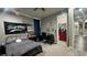 Cozy bedroom features sporty decor, neutral walls, plush carpet, and a walk-in closet at 716 Cadence View Way, Henderson, NV 89011