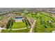 An aerial view of a community park with a pool, green spaces, and meandering paths for outdoor enjoyment at 716 Cadence View Way, Henderson, NV 89011