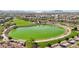 Community park aerial view featuring a scenic lake, walking paths, and lush greenery, ideal for recreation at 716 Cadence View Way, Henderson, NV 89011