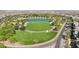 Aerial view of a beautifully landscaped park, pond, and expansive green space in a vibrant community at 716 Cadence View Way, Henderson, NV 89011